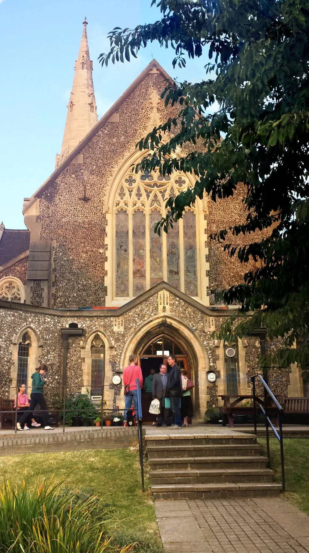 A portrait view of Cornerstone Community Centre’s flint entrance and stained-glass window