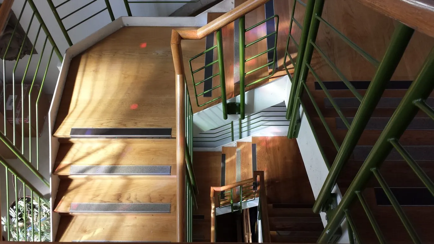 Sunlight across the timber staircase inside Cornerstone Community Centre