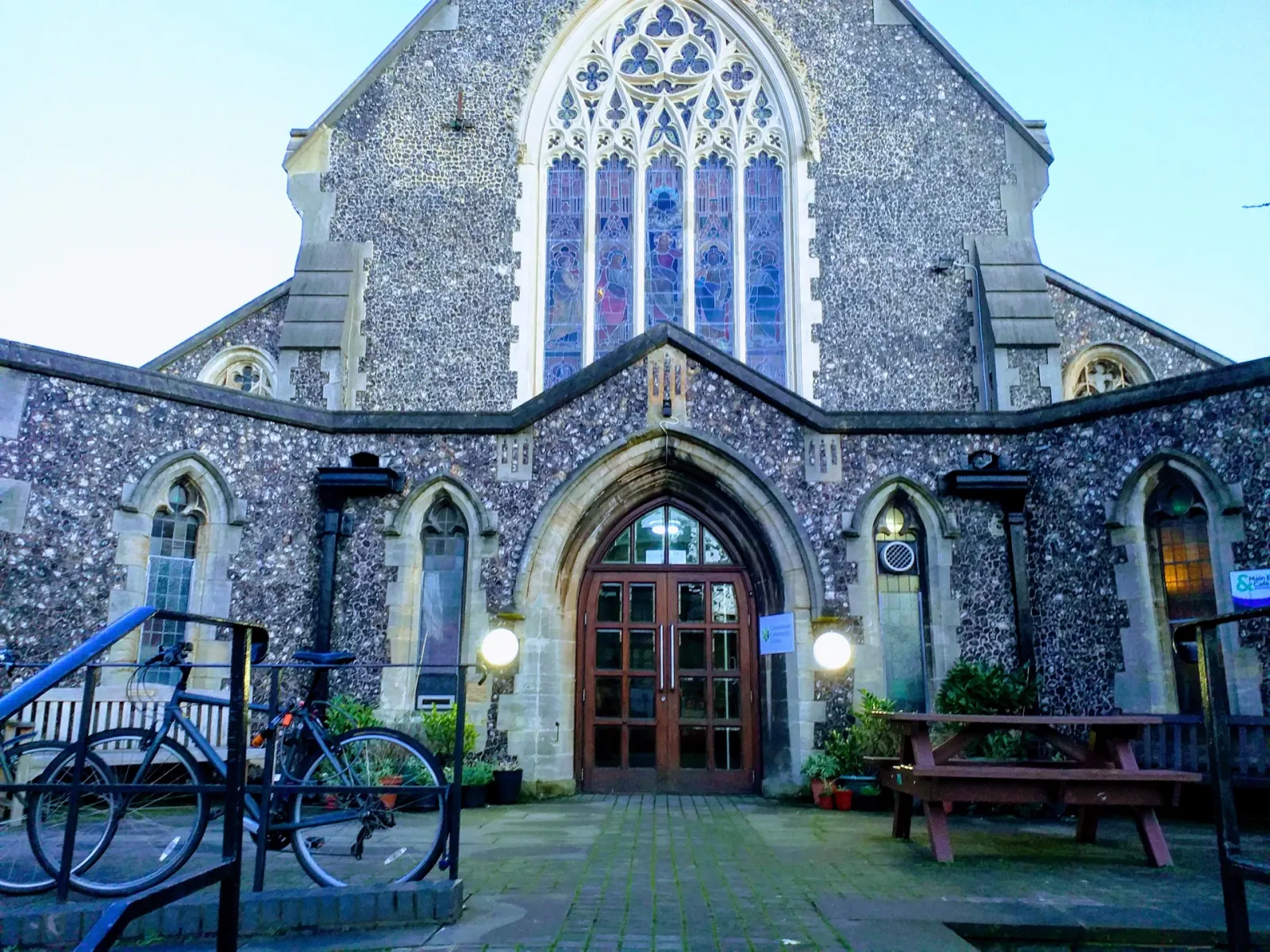 Cornerstone’s flint entrance and stained-glass window